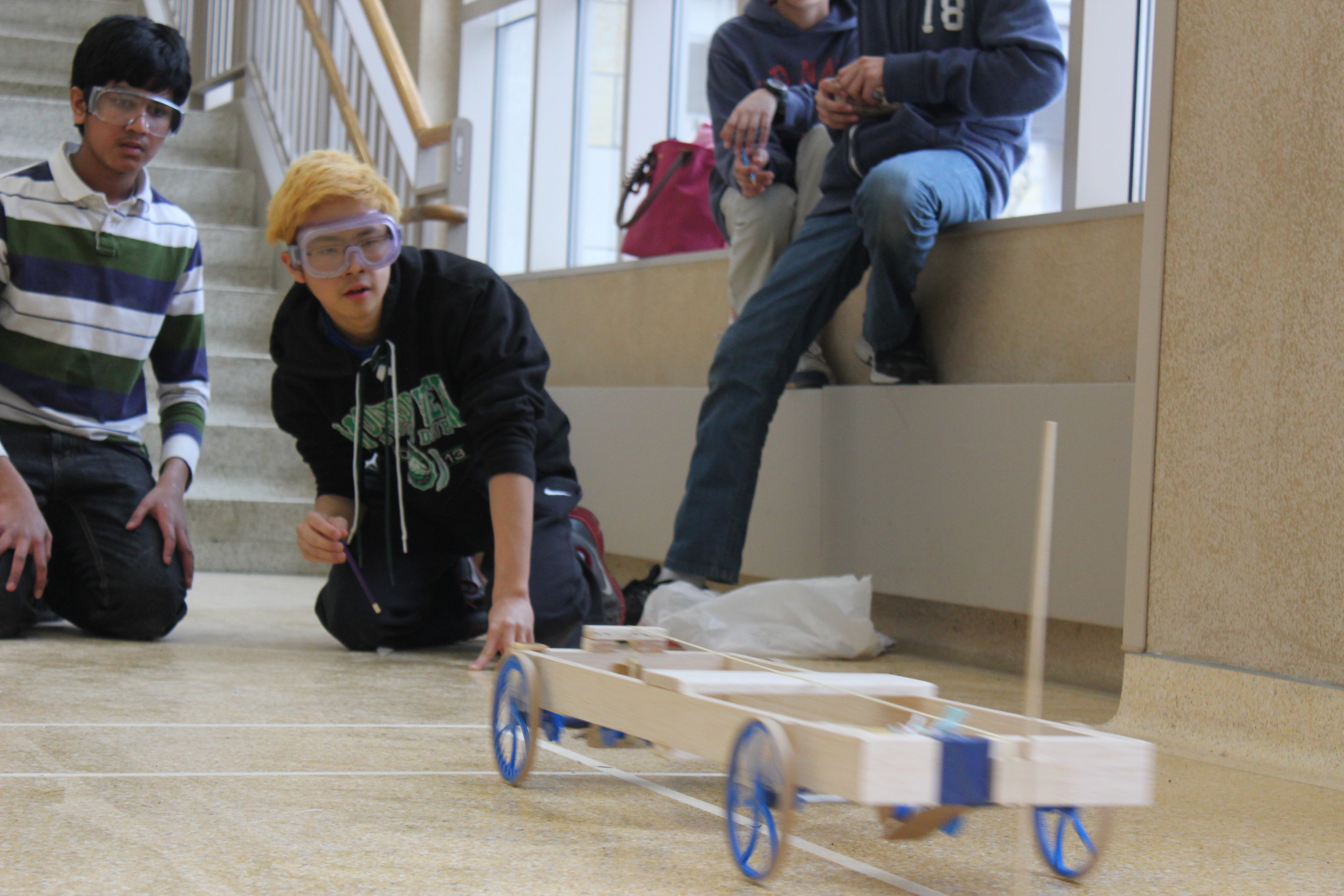 Students launching a wheeled vehicle in Science Olympiad